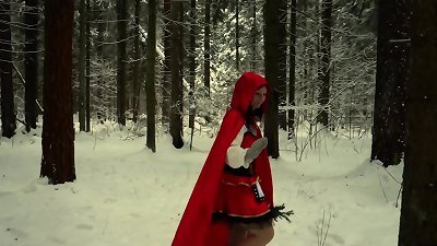 red bondage mask in the snowy forest